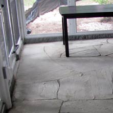 Indoor patio done in large irregular shaped bluestone set in cement